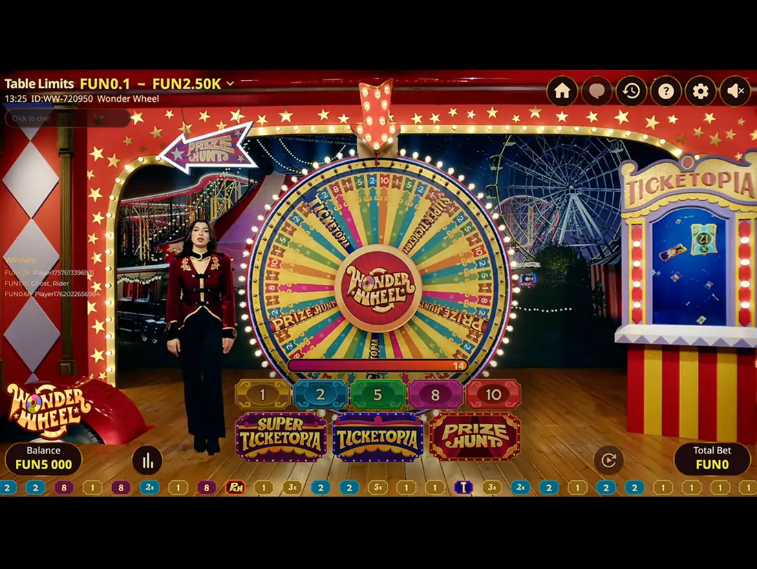 Wonder Wheel studio with a presenter beside a 54-sector wheel, a bet row of 1, 2, 5, 8 and 10, and Ticketopia and Prize Hunt panels
